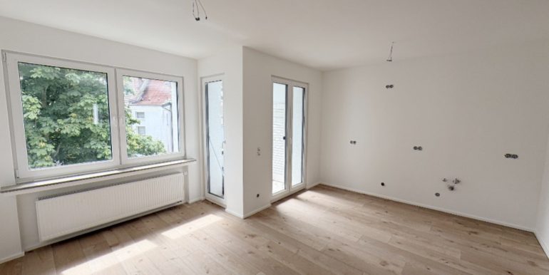 Wohnzimmer mit offener Küche